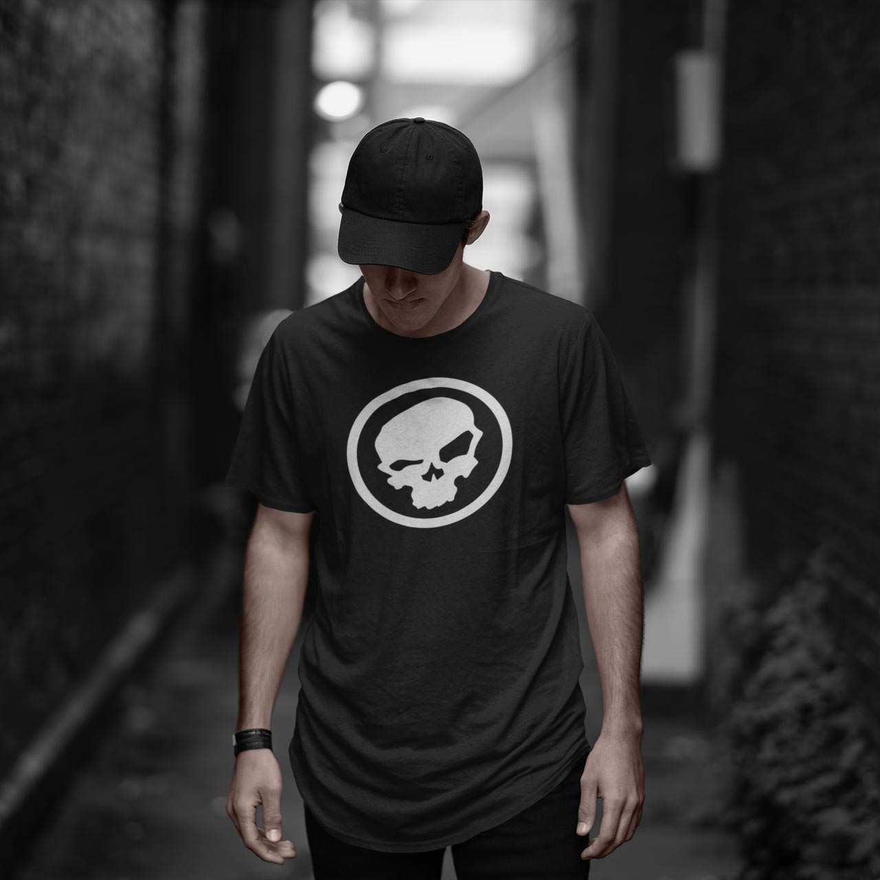 man in a hat wearing the urban pirate skull logo tshirt