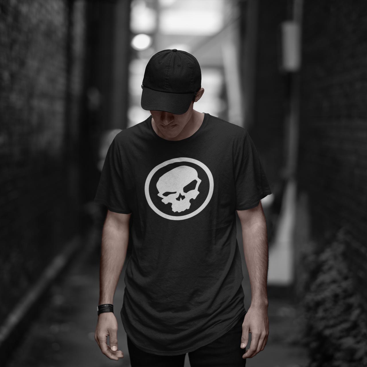 
                  
                    man in a hat wearing the urban pirate skull logo tshirt
                  
                